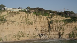 DCA08_250 - 4K aerial stock footage tilt to reveal clifftop homes with ocean views, La Jolla, California