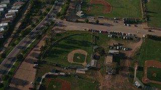 DCA08_267 - 4K aerial stock footage of community sports fields and office buildings, San Diego, California