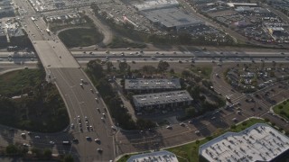 DCA08_268 - 4K aerial stock footage of light freeway traffic and overpass, San Diego, California