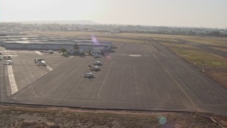 DCA08_269 - 4K aerial stock footage approach a small airfield for landing, Montgomery Field, California