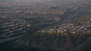 DCA08_281 - 4K aerial stock footage video of suburban neighborhoods and freeway, La Jolla ,California, Sunset