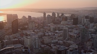 DCA08_302 - 4K aerial stock footage approach skyscrapers at sunset in Downtown San Diego, California