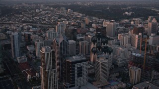 DCA08_310 - 4K aerial stock footage of panning across skyscrapers in Downtown San Diego, California, Sunset