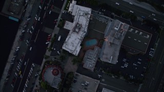 DCA08_326 - 4K aerial stock footage of a bird's eye view of city streets and buildings in Downtown San Diego, California, Sunset