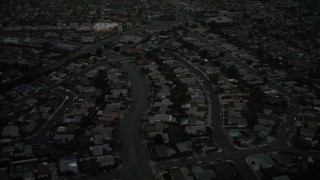 DCA08_338 - 4K aerial stock footage of tract homes in the suburbs, Serra Mesa, California, twilight