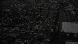 DCA08_339 - 4K aerial stock footage of tract homes and apartment buildings, Serra Mesa, California, twilight