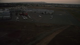 DCA08_340 - 4K aerial stock footage of landing at Montgomery Field airport in California, twilight
