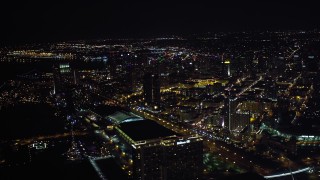 DCA08_344 - 4K aerial stock footage of skyscrapers, hotels, convention center and stadium in Downtown San Diego, California, at night