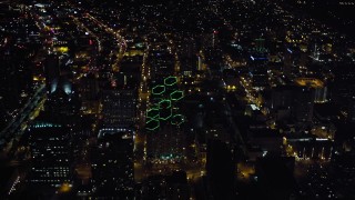 DCA08_347 - 4K aerial stock footage orbit city buildings and tilt to skyscrapers, Downtown San Diego, California, Night