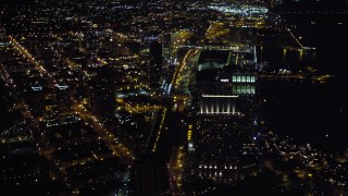 DCA08_354 - 4K aerial stock footage of panning across the city to reveal a luxury waterfront hotel, Downtown San Diego, California, Night