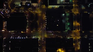 DCA08_361E - 4K aerial stock footage of a bird's eye view of city streets, reveal city buildings in Downtown San Diego, California, Night