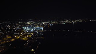 DCA08_364 - 4K stock footage aerial video of panning across downtown to reveal the Coronado Bridge and San Diego Bay, California, Night