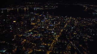 DCA08_369 - 4K aerial stock footage of flying by city skyscrapers in Downtown San Diego, California, Night