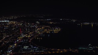 DCA08_373 - 4K aerial stock footage of flying by skyscrapers and part of the bay, Downtown San Diego, California, Night