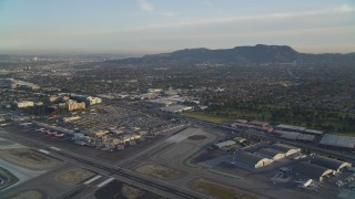 DCLA_002 - 5K aerial stock footage fly over runways at Burbank Airport and tilt to terminals at sunset, California