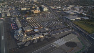 DCLA_003 - 5K aerial stock footage of terminals and parking lots at the Burbank Airport at sunset, California