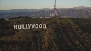 DCLA_006 - 5K aerial stock footage flyby the Hollywood Hills to reveal the Hollywood Sign at sunset, California