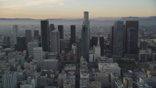 DCLA_019 - 5K aerial stock footage tilt from 5th Street to reveal and approach Downtown Los Angeles skyscrapers at sunset, California