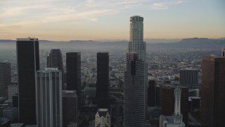 DCLA_020 - 5K aerial stock footage tilt from 5th Street to reveal skyscrapers in Downtown Los Angeles at sunset, California