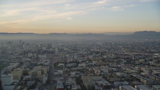 DCLA_022 - 5K aerial stock footage approach Hollywood from Downtown Los Angeles, California at sunset