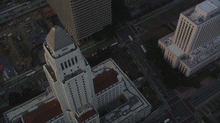 DCLA_029 - 5K aerial stock footage approach Los Angeles City Hall at sunset in Downtown Los Angeles, California