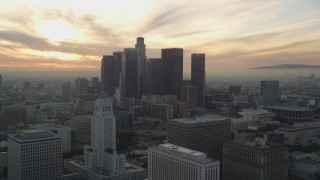 DCLA_031 - 5K aerial stock footage reverse view of City Hall and Downtown Los Angeles skyline at sunset, California