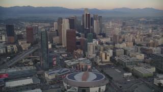 DCLA_040 - 5K stock footage aerial video of Staples Center, The Ritz-Carlton and skyscrapers in Downtown Los Angeles at sunset, California