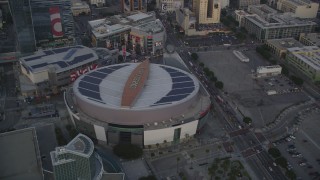 DCLA_041 - 5K aerial stock footage tilt from Staples Center to reveal Downtown Los Angeles at sunset, California