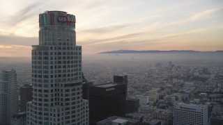 DCLA_049 - 5K aerial stock footage fly over high-rise to approach US Bank Tower at sunset in Downtown Los Angeles, California