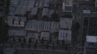 DCLA_053 - 5K aerial stock footage track police helicopter pounding Downtown Los Angeles high-rise at twilight, California