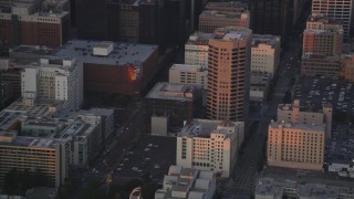 DCLA_054 - 5K aerial stock footage track police helicopter over Downtown Los Angeles office buildings at twilight, California
