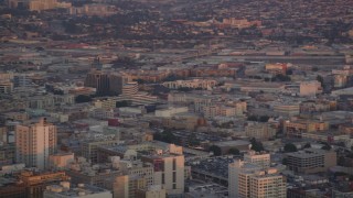 DCLA_055 - 5K aerial stock footage of tracking police helicopter circling over Downtown Los Angeles at twilight, California