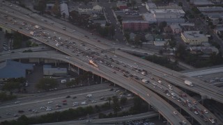DCLA_059 - 5K aerial stock footage track police helicopter over freeway gridlock at twilight in Downtown Los Angeles, California