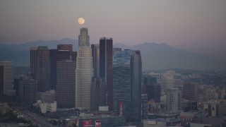 DCLA_062 - 5K aerial stock footage of full moon over Downtown Los Angeles skyscrapers at twilight, California