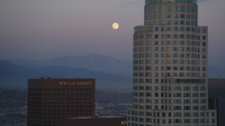 DCLA_073 - 5K aerial stock footage of full moon and skyscrapers in Downtown Los Angeles at twilight, California
