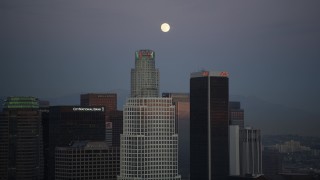 DCLA_080 - 5K aerial stock footage orbit The Ritz-Carlton to reveal Downtown Los Angeles towers and full moon at twilight, California