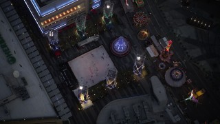 DCLA_083 - 5K stock footage aerial video bird's eye orbit of ice skating rink and fair in Downtown Los Angeles at twilight, California