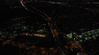 DCLA_088 - 5K aerial stock footage fly over light traffic on Interstate 5 through San Fernando at night, California