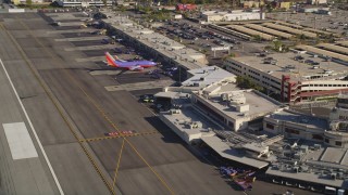 DCLA_105 - 5K aerial stock footage fly low over runway and approach terminals at Burbank Airport, California