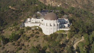 DCLA_111 - 5K aerial stock footage orbit the face of the hilltop Griffith Observatory in Los Angeles, California