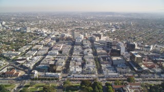 DCLA_118 - 5K stock footage aerial video tilt from Beverly Hills mansions to reveal shops and office buildings by Santa Monica Boulevard, California