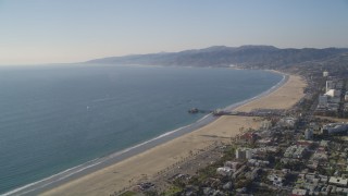 DCLA_121 - 5K stock footage aerial video approach the beach and Santa Monica Pier in California