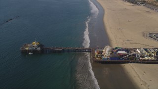 DCLA_127 - 5K aerial stock footage orbit visitors and rides at Santa Monica Pier in California