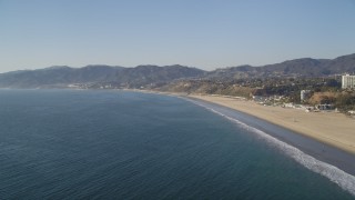 DCLA_130 - 5K aerial stock footage fly over the ocean near the beach in Santa Monica, California
