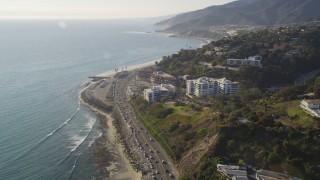 DCLA_135 - 5K aerial stock footage follow Highway 1 to approach condos in Pacific Palisades, California