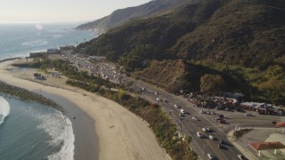 DCLA_139 - 5K aerial stock footage tilt from Highway 1 and beach to Malibu, California
