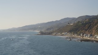 DCLA_144 - 5K aerial stock footage of beachfront homes lining the coast in Malibu, California