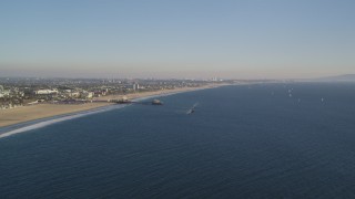 DCLA_179 - 5K aerial stock footage of slow approach to Santa Monica Pier and the beach in California