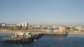 DCLA_181 - 5K stock footage aerial video fly near the end of Santa Monica Pier with rides in California
