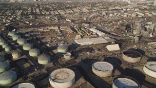 DCLA_194 - 5K aerial stock footage pan across oil refinery tanks and buildings in El Segundo, California